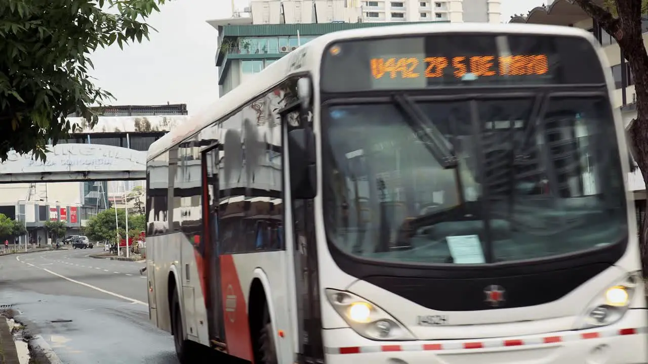 The bus drives from the bus station and passes by  transporting people during the pandemic and quarantine  Panama City