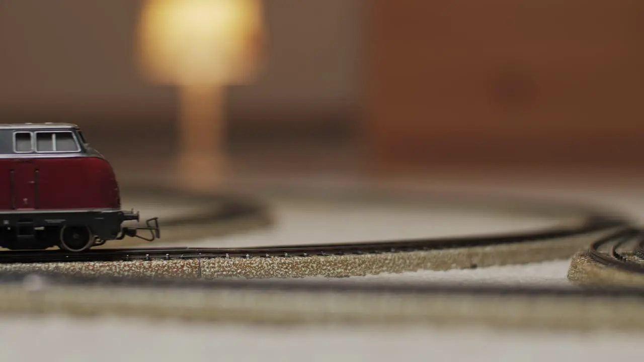 Model train moving into the shot on a track with a blurry background