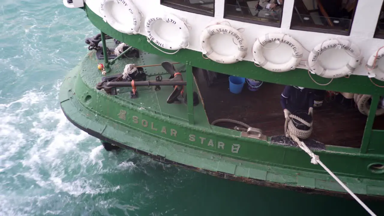 Attaching rope to a boat in the harbor