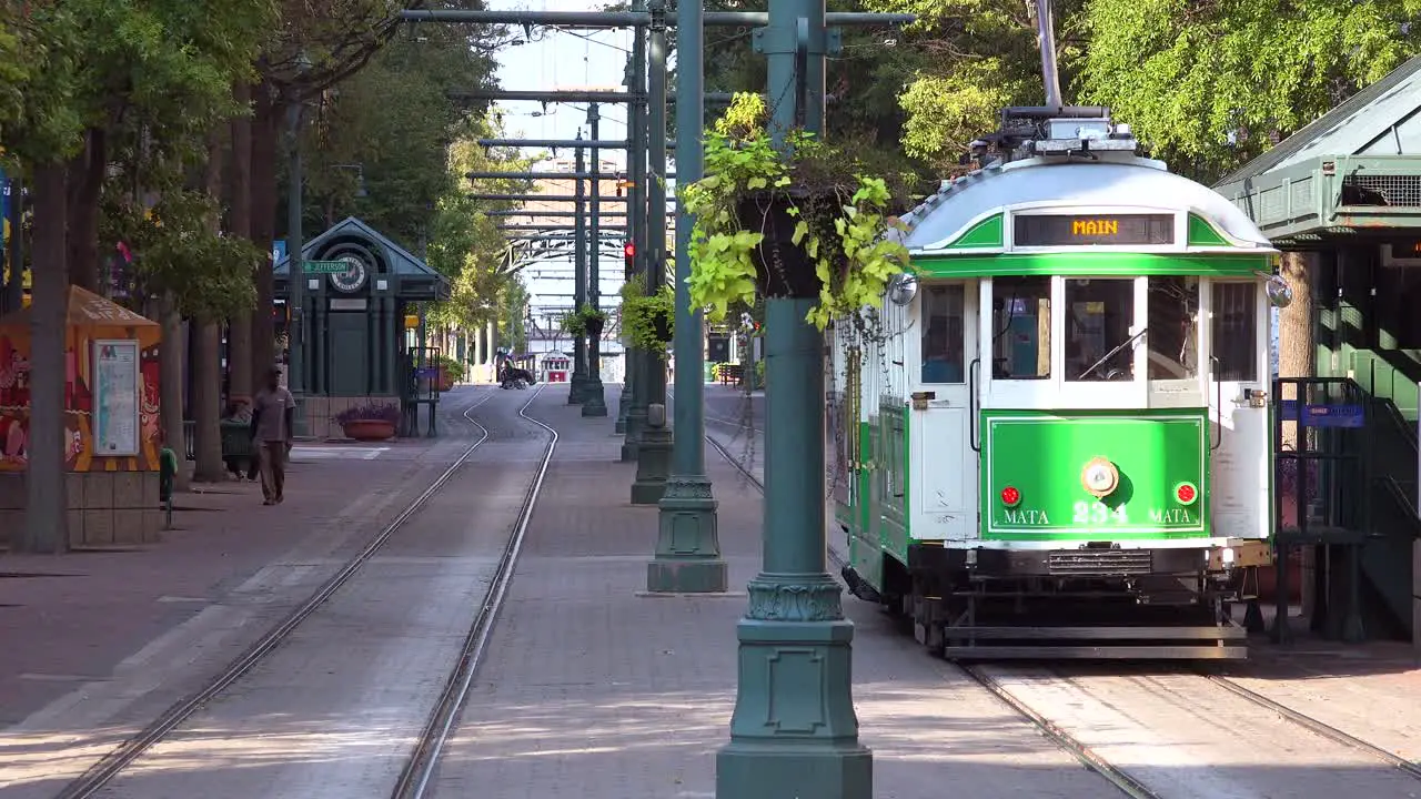 Vintage trolleys streetcars move through downtown business district in Memphis Tennessee