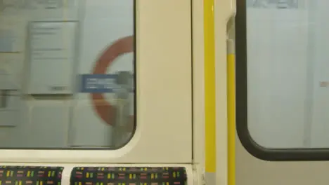 London Underground Train Passing Through A Station