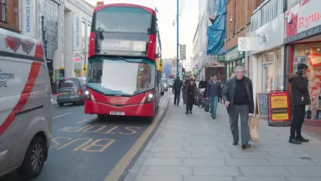 Shops On Putney High Street London Busy With Shoppers And Traffic 2