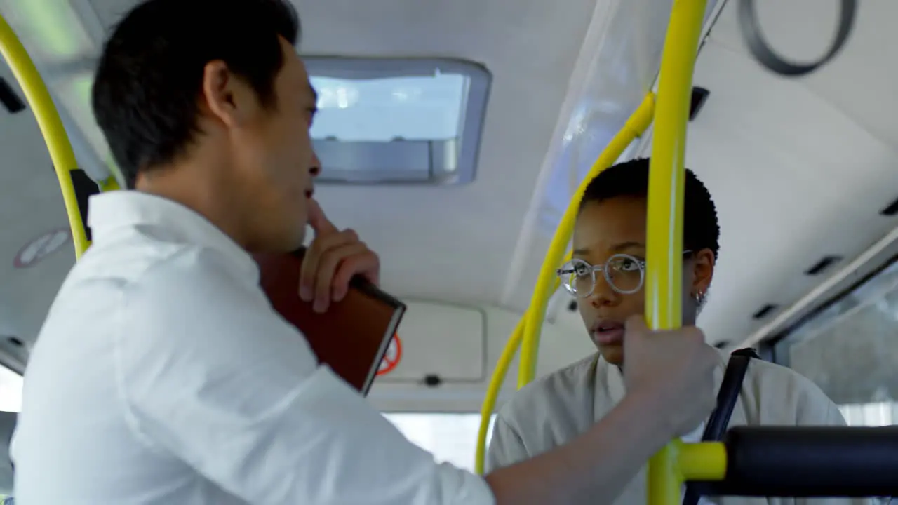 Commuters interacting with each other while travelling in bus 4k