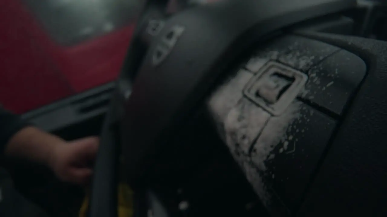 Macro shot of spraying the wheel buttons of a wheel Volvo Semi Truck