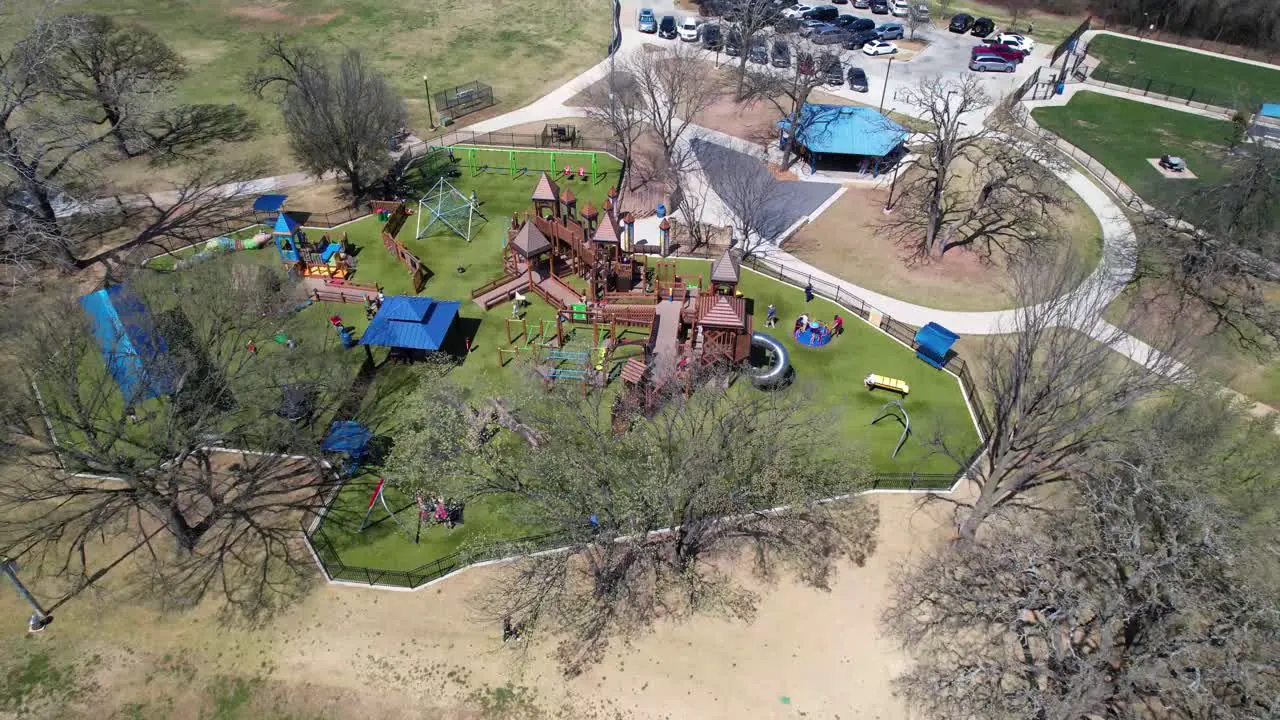 Aerial footage of the Kid's Kastle playground at Unity Park in Highland Village Texas