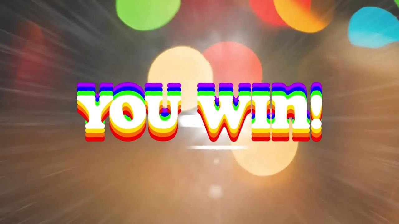 Animation of you win text in rainbow colours over colourful spots on glowing background