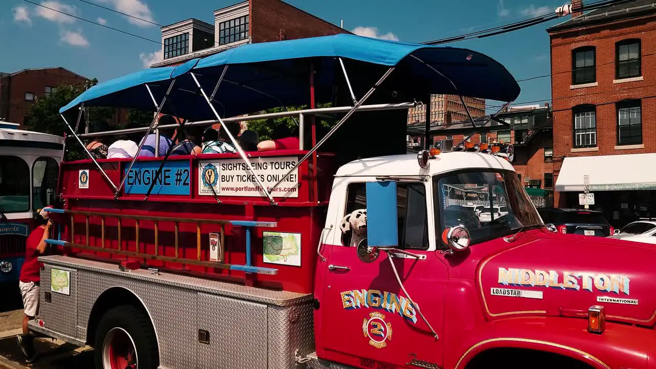 Tour vehicles with tourists waiting to visit Portland Maine