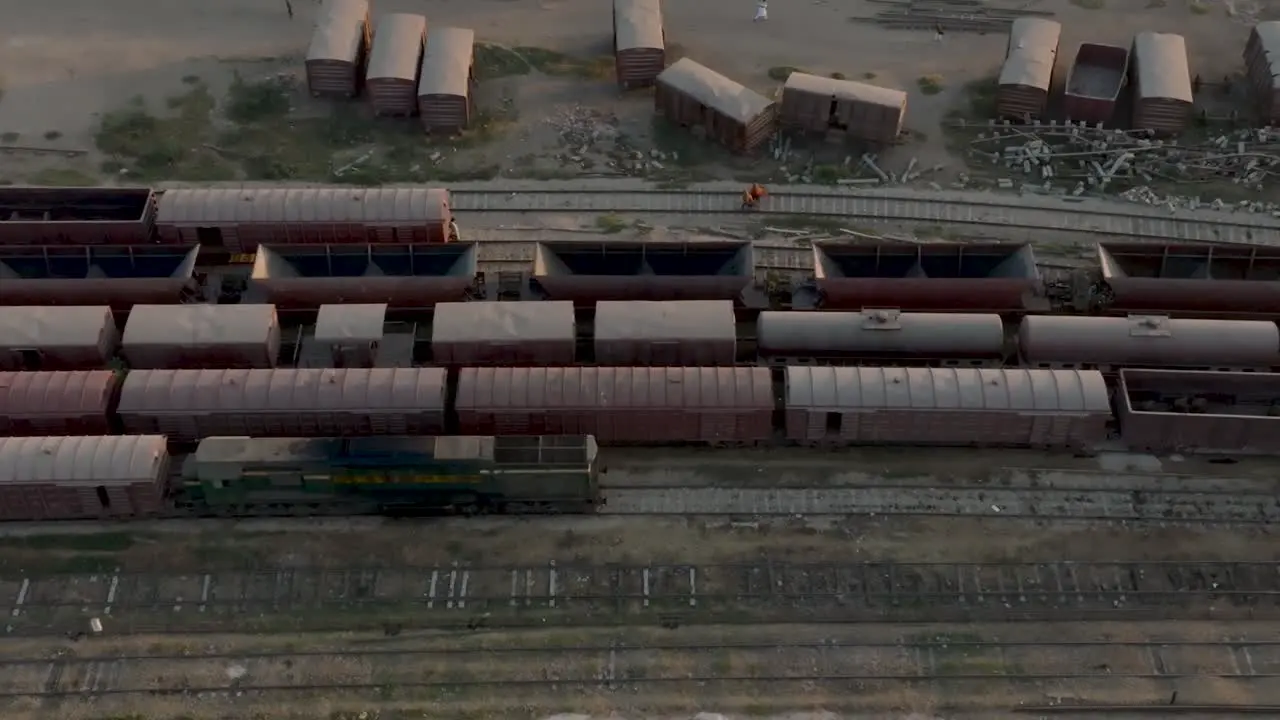 Aerial top down photo of railway transportation hub showing the different trains parked next to each other on the rails