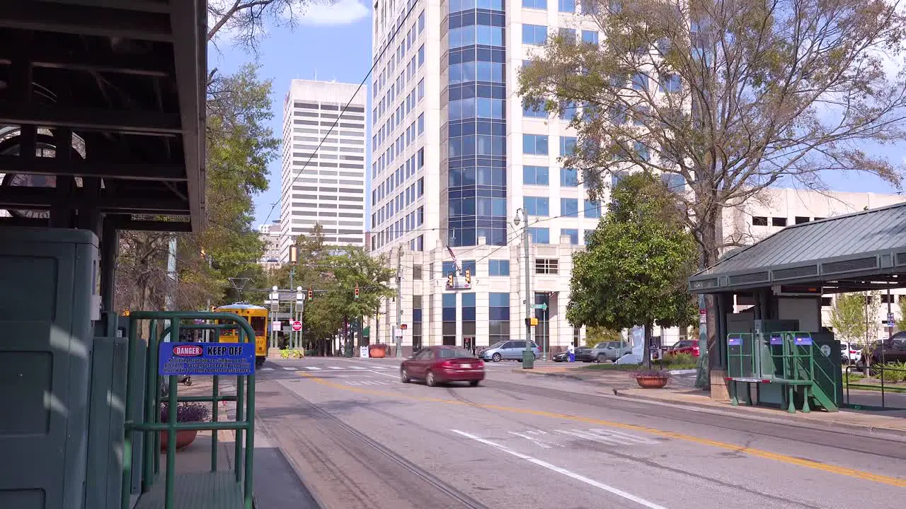 Memphis trolley car on a busy street outside downtown business district office buildings