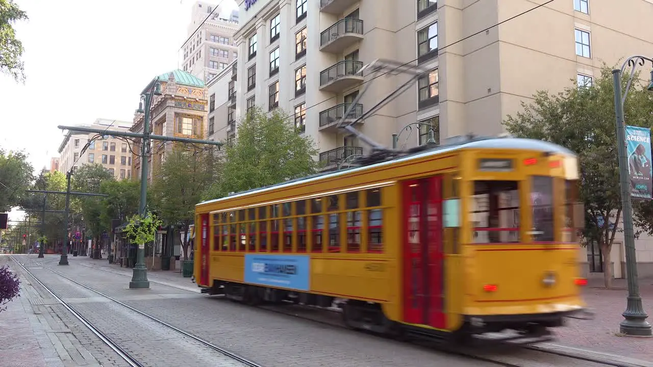 Memphis trolley car on a busy street outside downtown business district office buildings 1