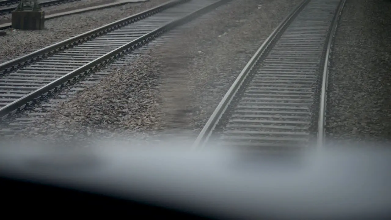 First-person view of train tracks from moving train