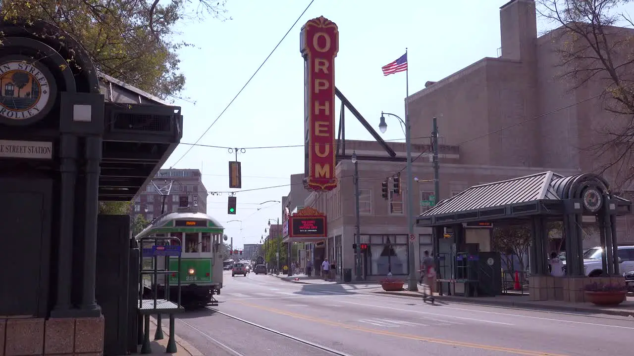 Memphis trolley car on a busy street outside the Orpheum Theater performing arts center