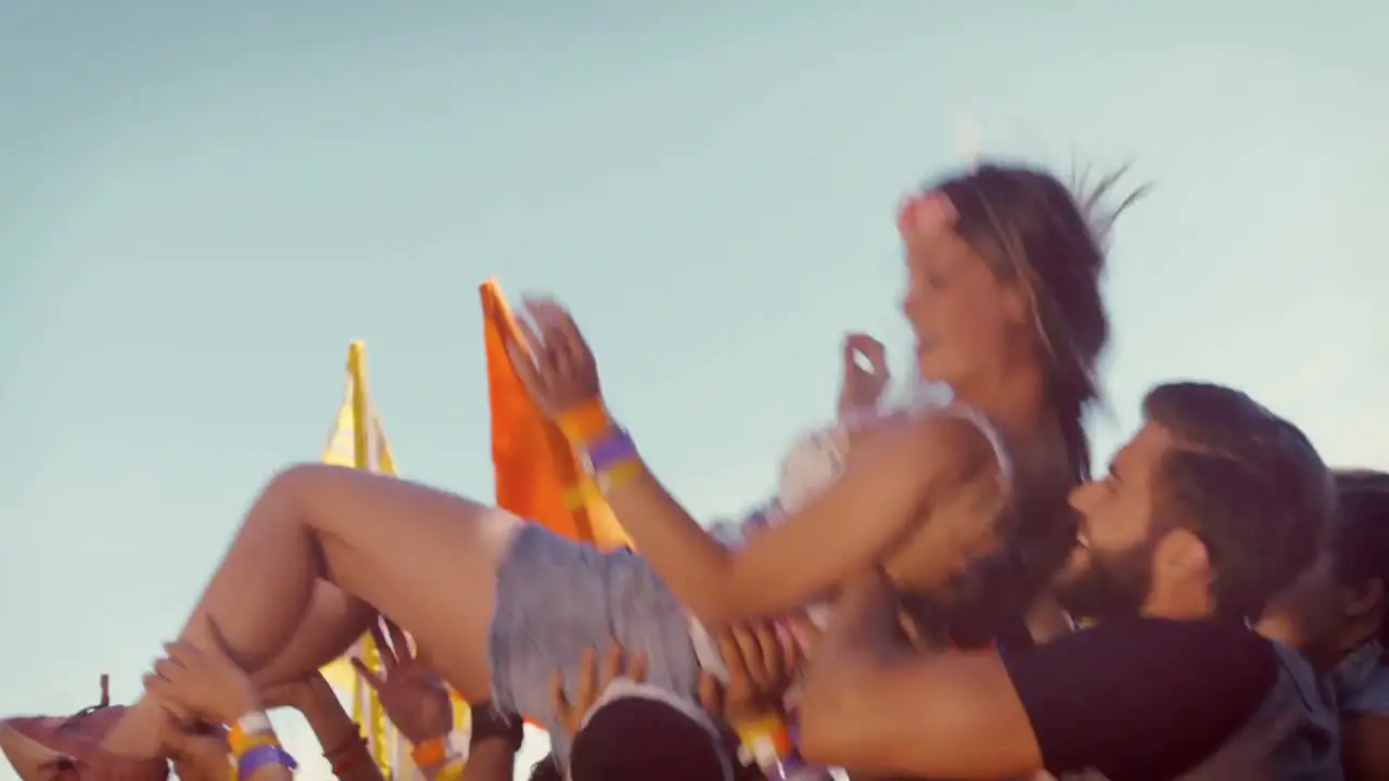 In high quality format happy hipster woman crowd surfing