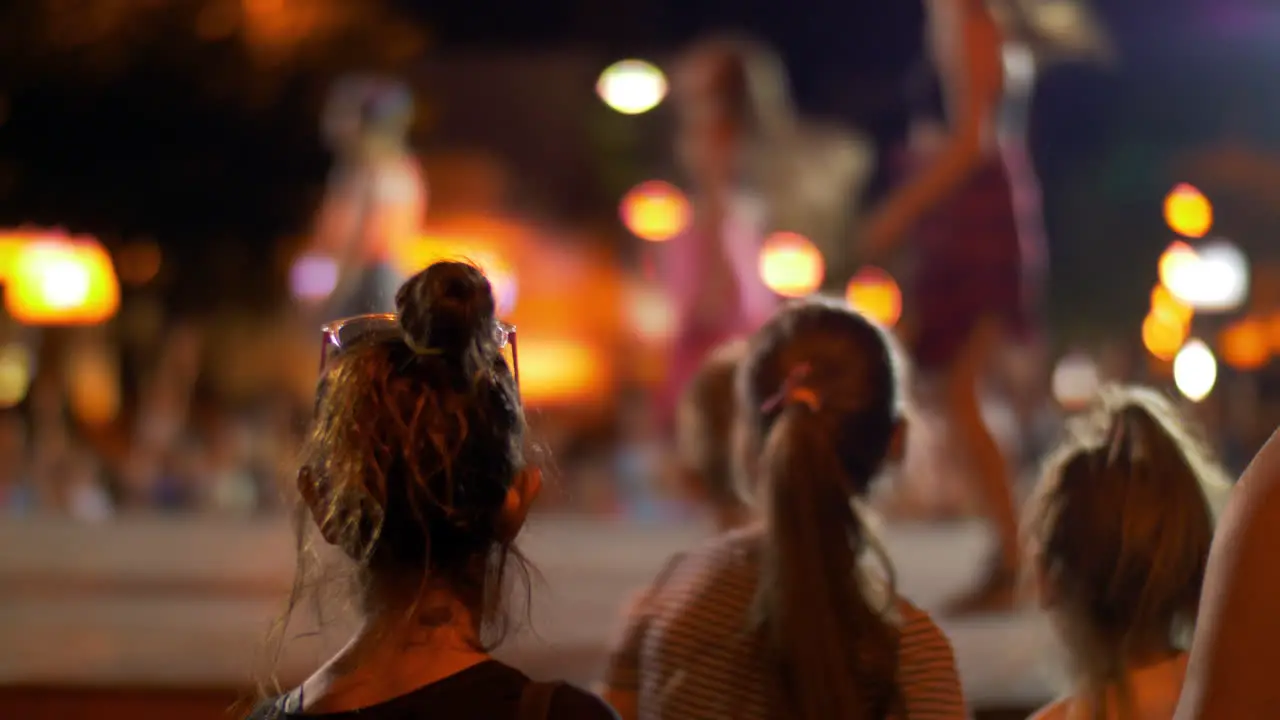 People watching outdoor dancing performance