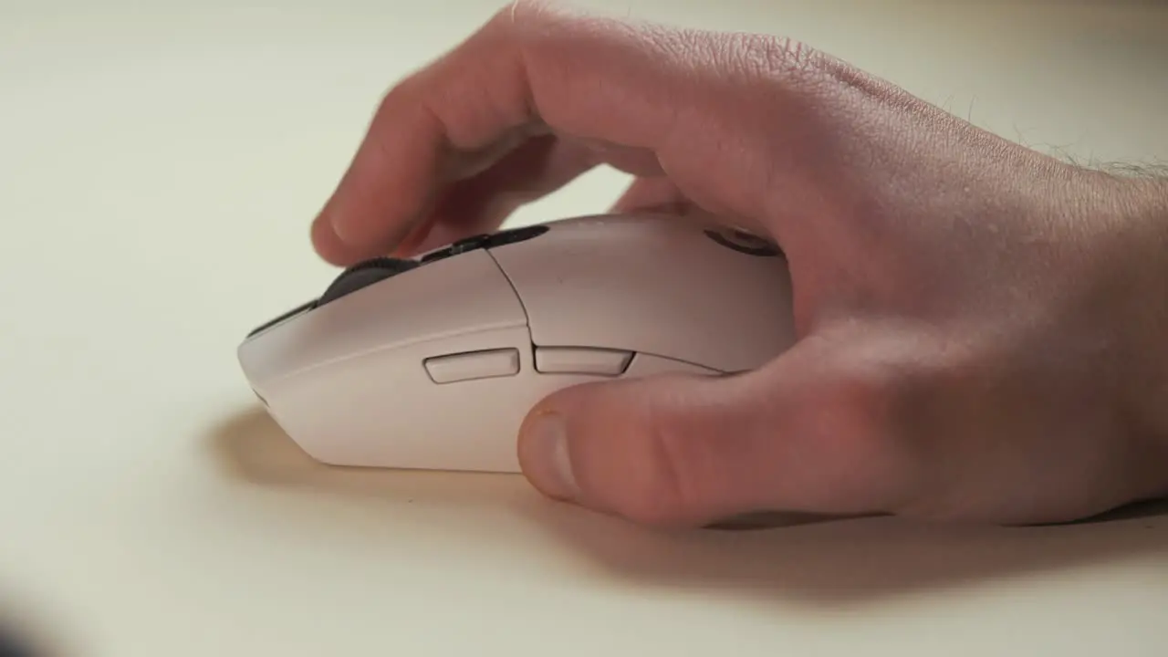 Man's hand using wireless mouse scrolling internet