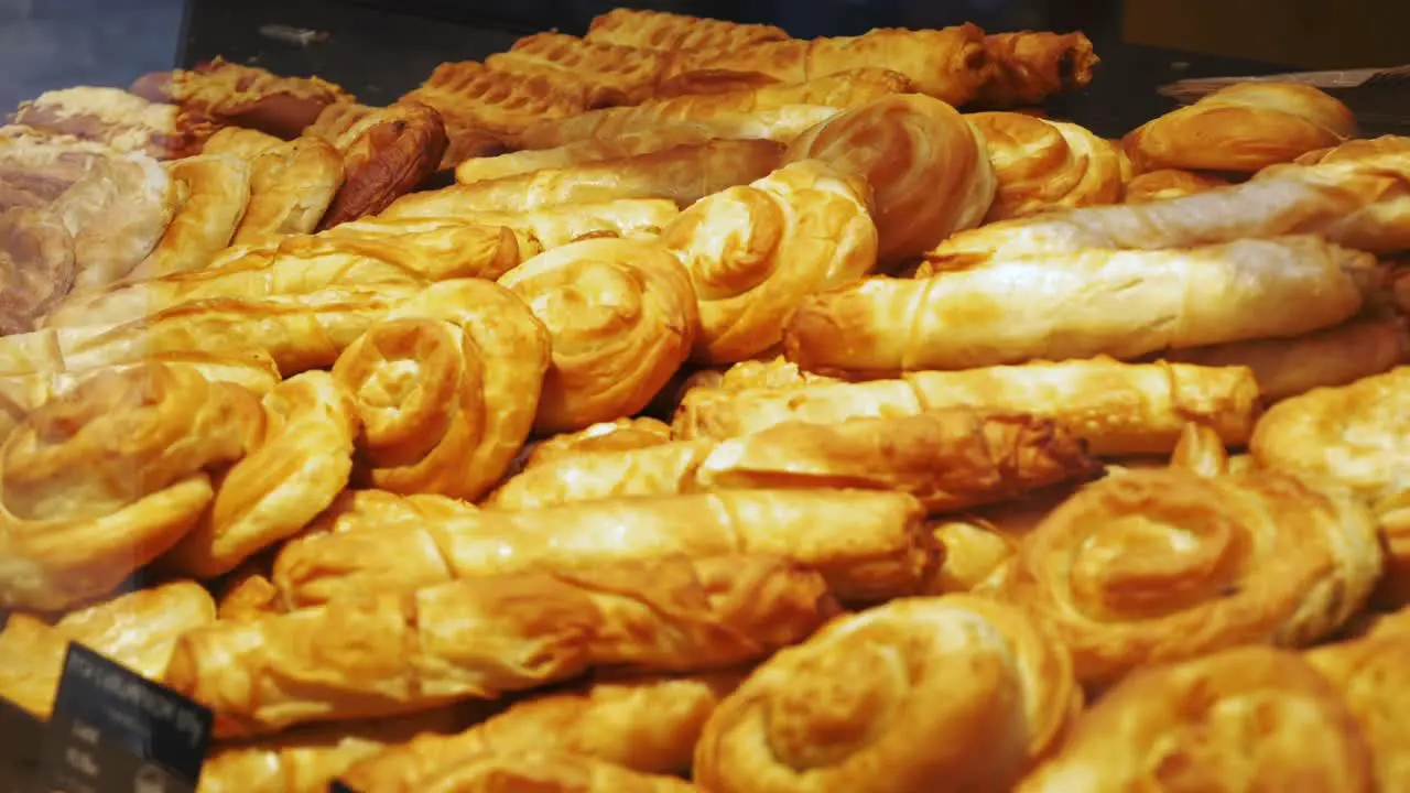 Traditional Croatian pastries displayed behind the window of a local shop