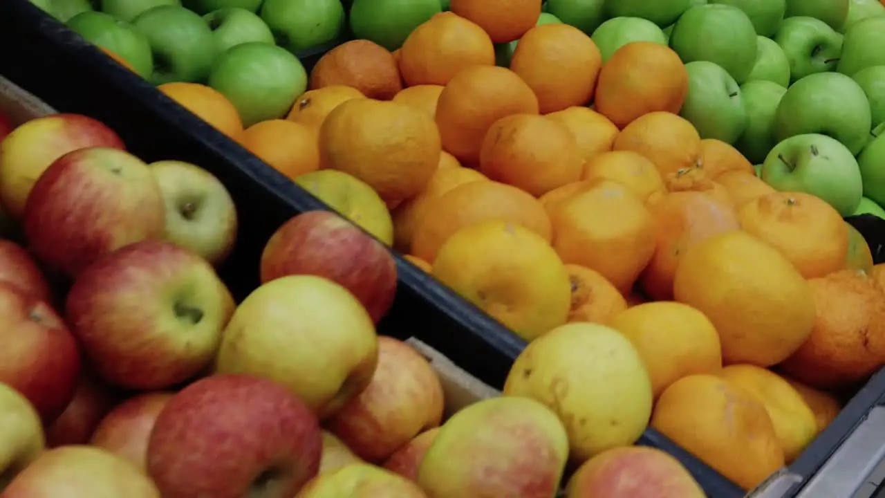 A slow motion shot passing over a fruit counter