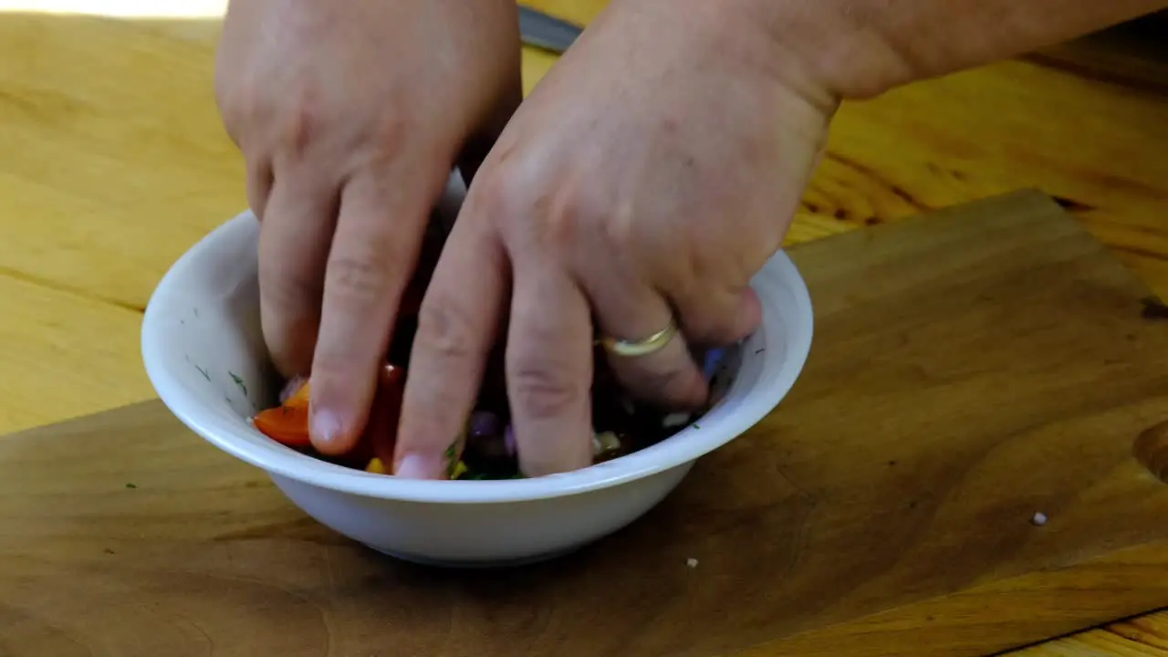 the chef mixing the salad