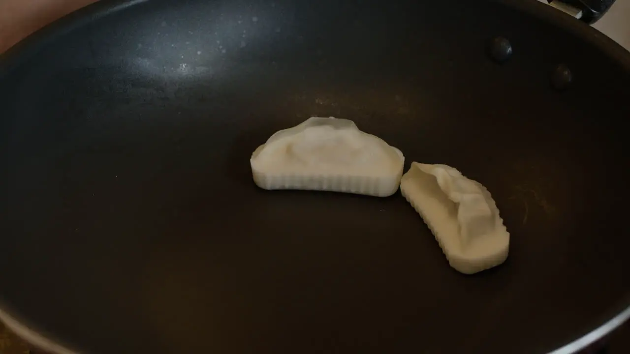 Close up of Chinese dumpling cooked in a pan traditional Asiatic food homemade