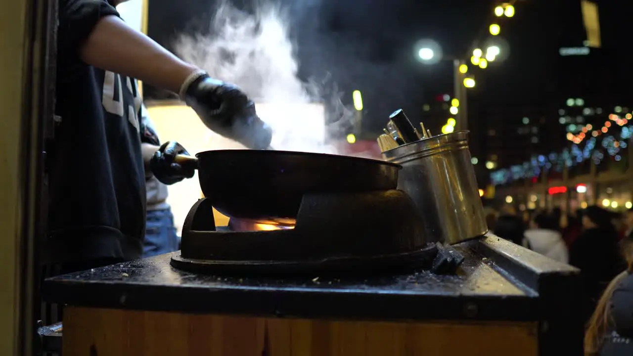 Chef toss up cooking food on a big frying pan