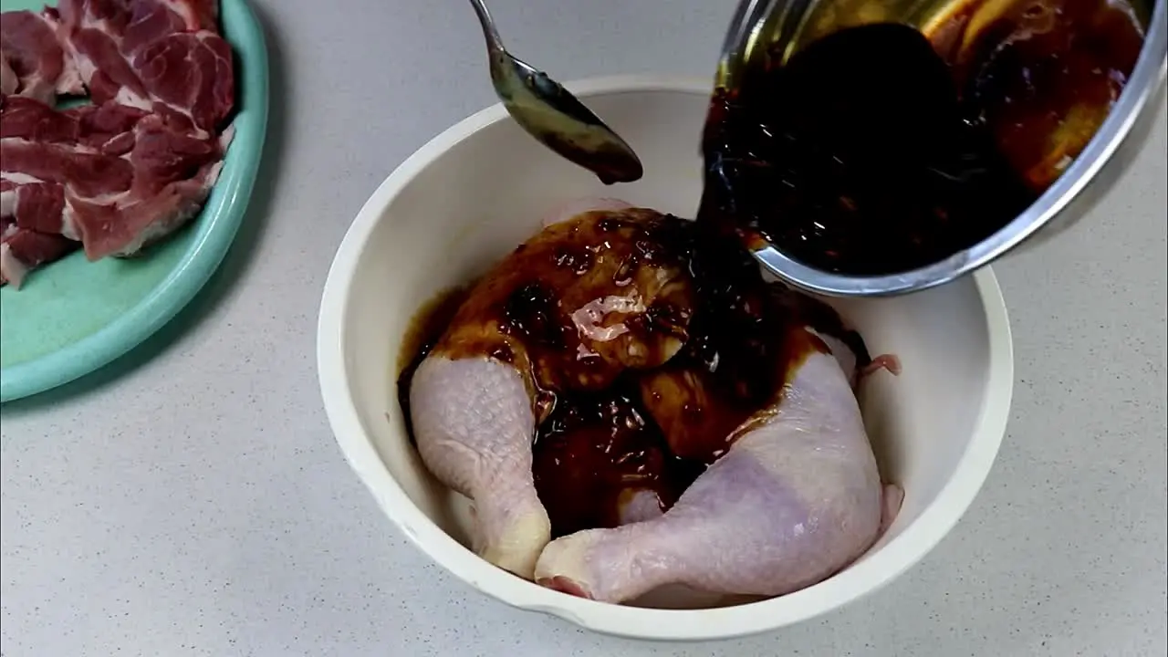 Pouring Marinade Over Chicken Legs