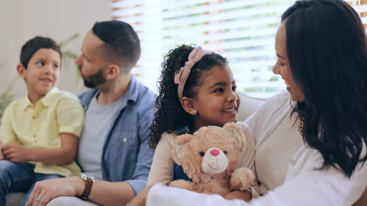 Parents laughing or mom with children in home