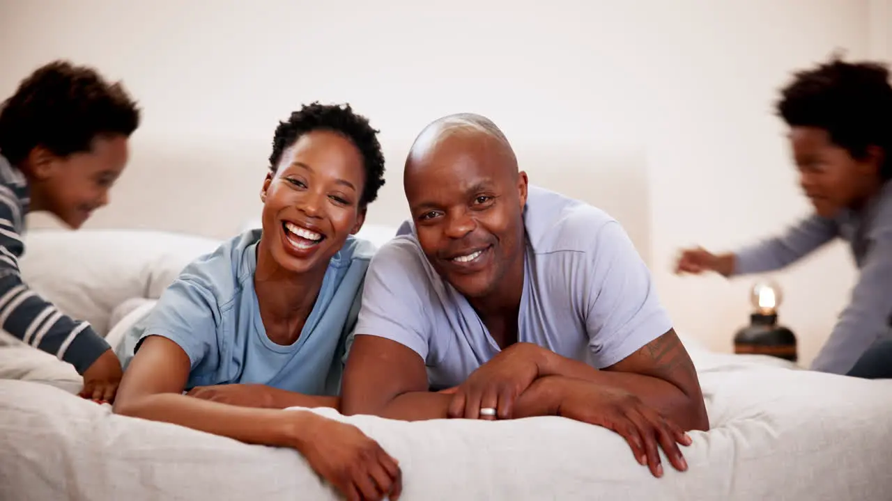 Happy family laughter or face with love on bed