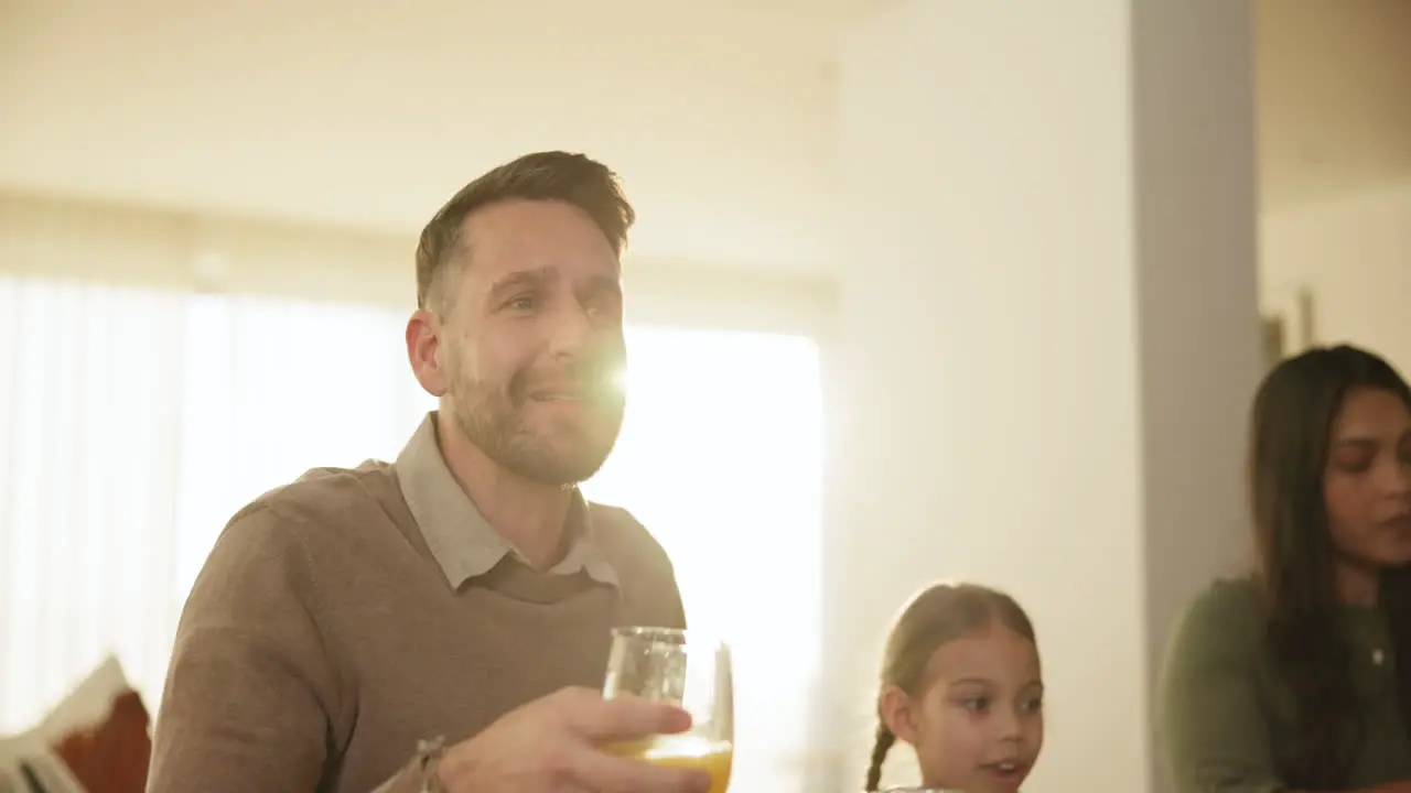 Happy cheers and man at family dinner in dining