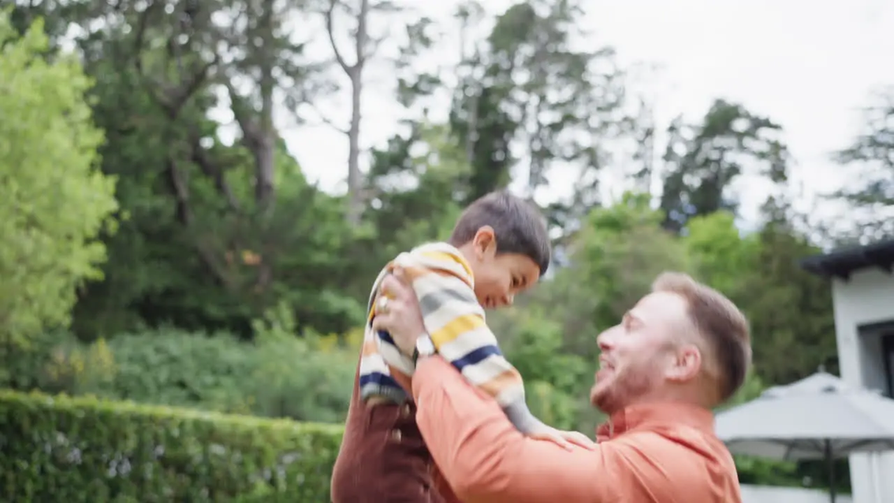 Father garden and lift boy in air for game