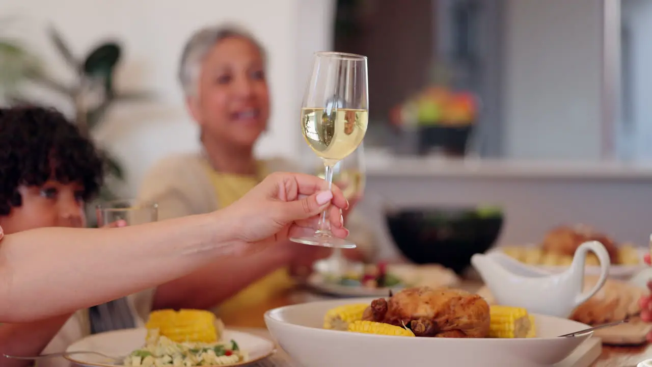 Happy family hands and toast for Christmas dinner