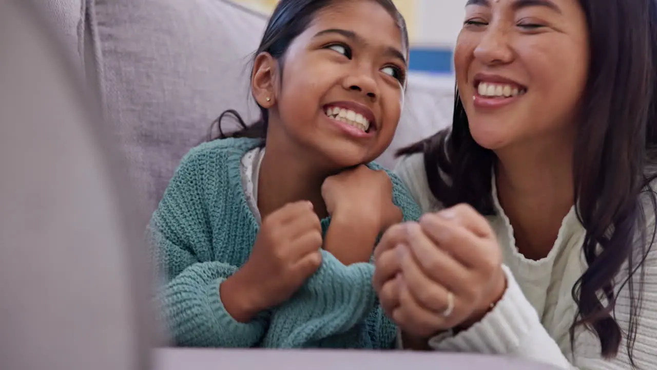 Love sofa and face of girl with mother in home