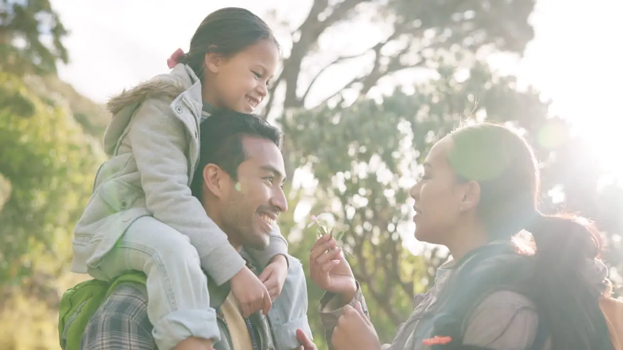 Happy family smell and flower outdoor in nature