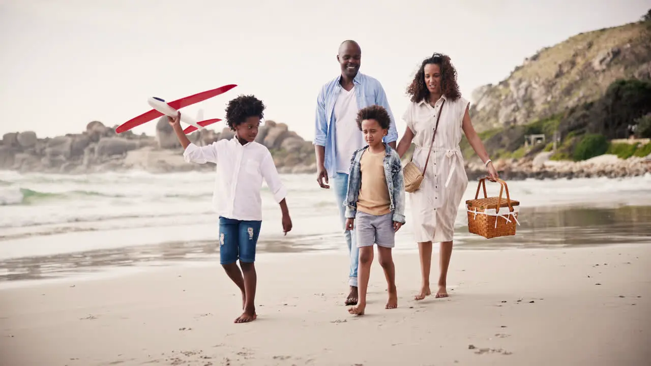 Walking happy family on beach together