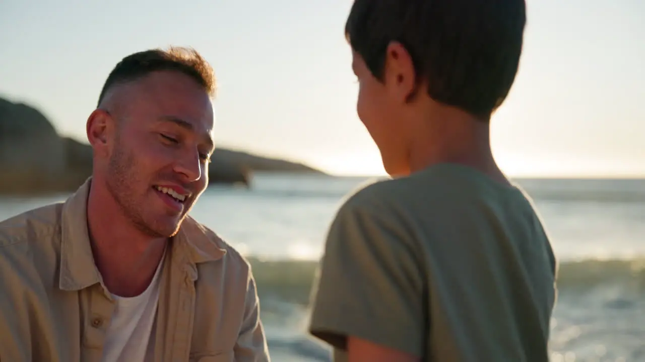 Father kid and hug on beach with sunshine