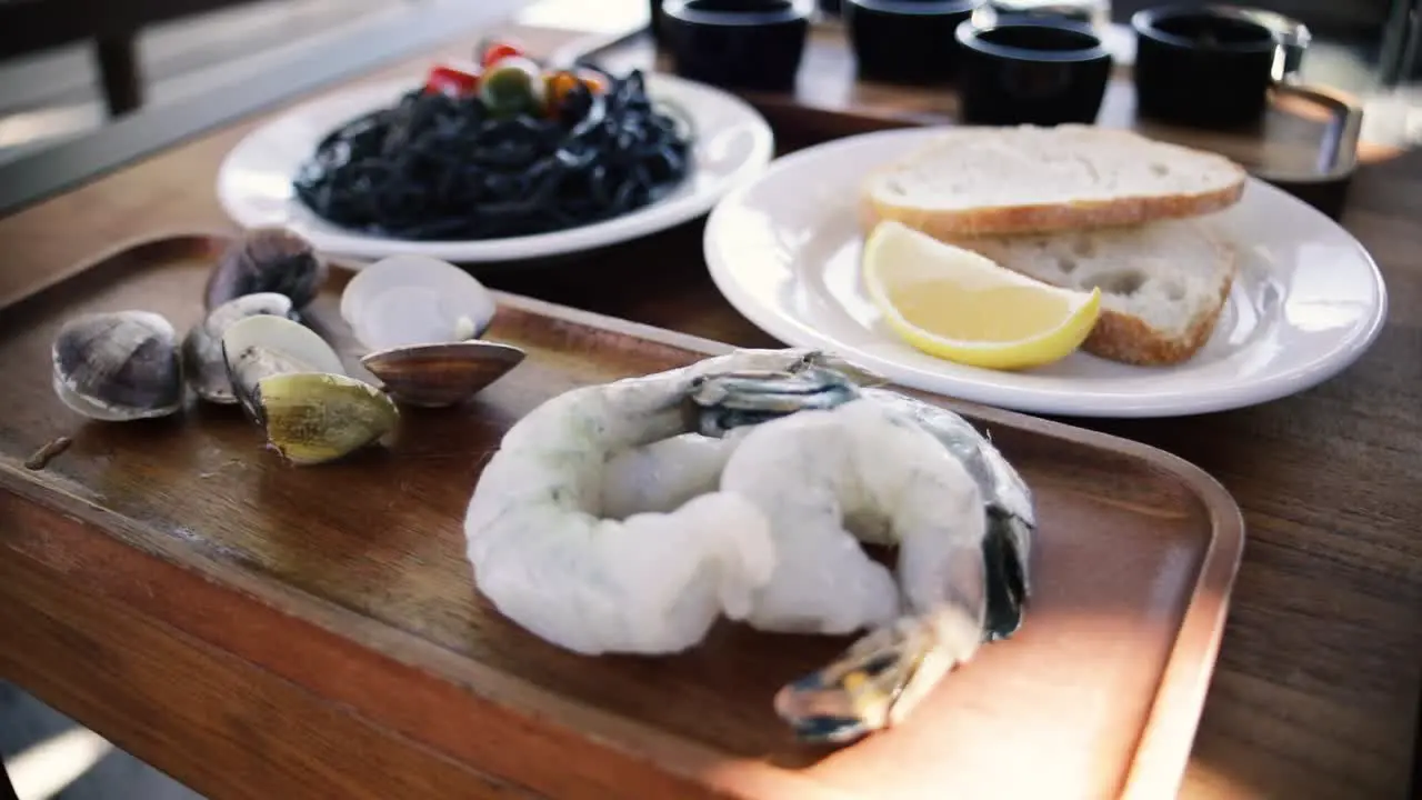 Shrimp and clams on a cooking board