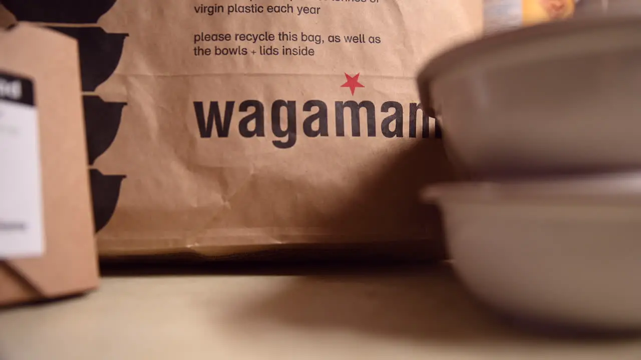 Close up of Wagamama takeaway food on a table at home