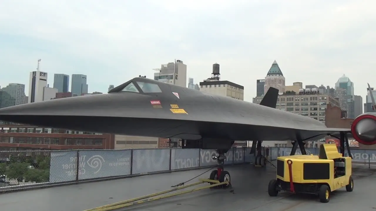 ZOOM OUT PAN Intrepid Sea Air Space American History Museum Fighter aircraft on display at carrier USS Interpid by New York