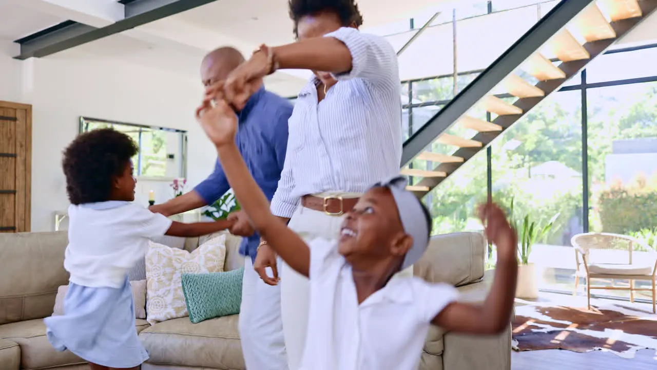 Mother father and kids dance in home together