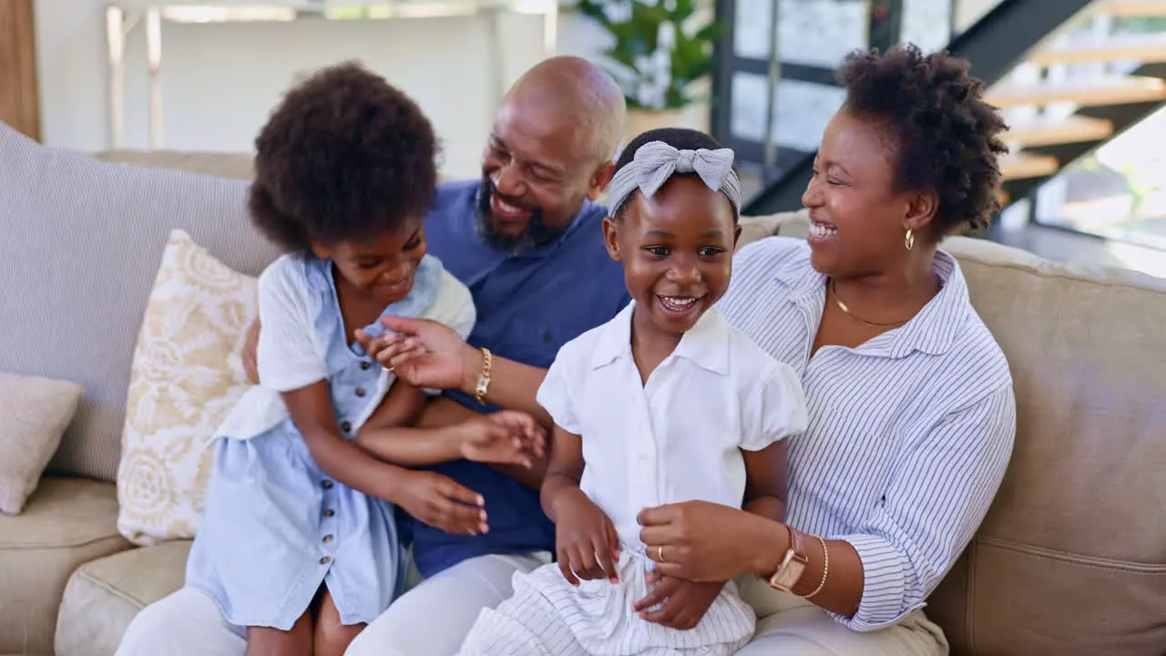 Happy family home and tickle on sofa