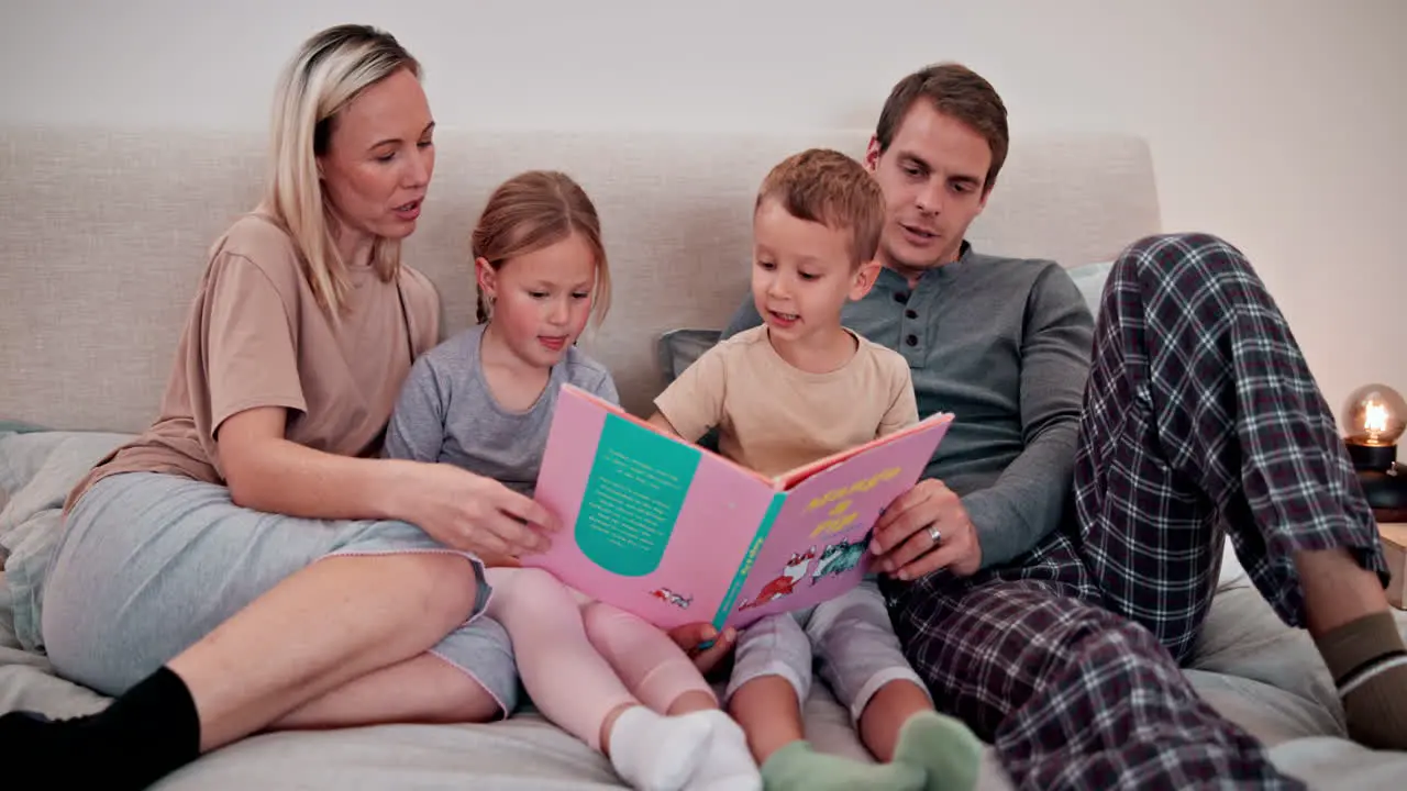 Parents kids and reading books in bedroom