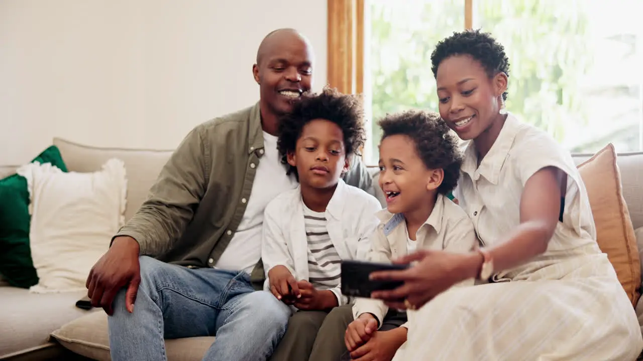 Happy black family sofa and selfie