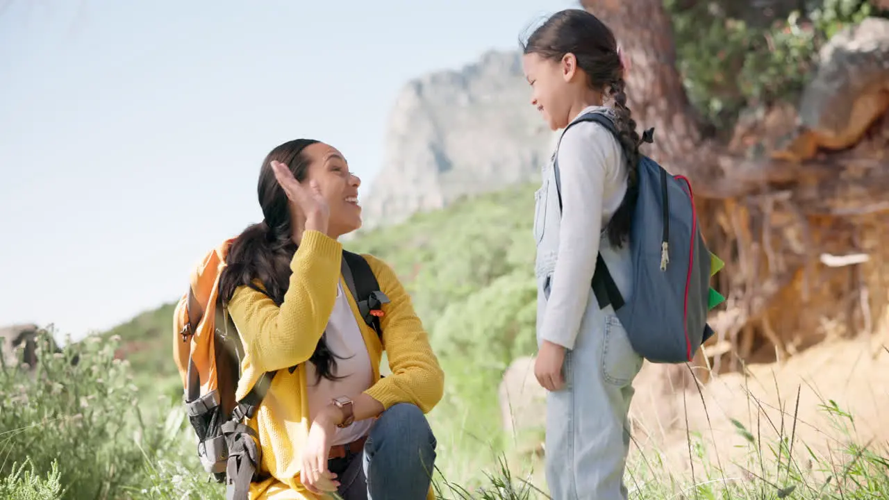 High five hiking and mother with girl child