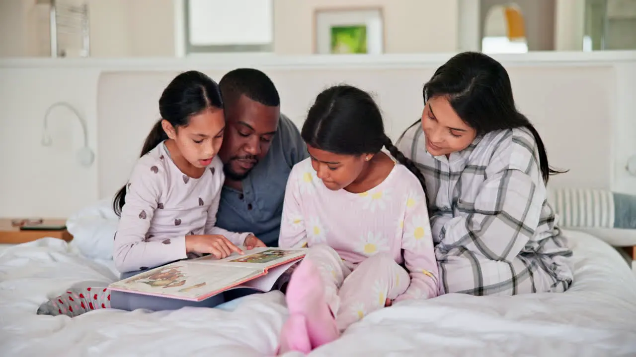 Parents girl children and bed with book