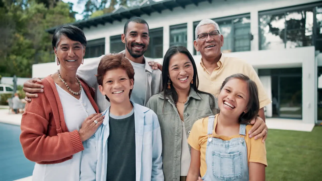 Happy big family hug and real estate on lawn