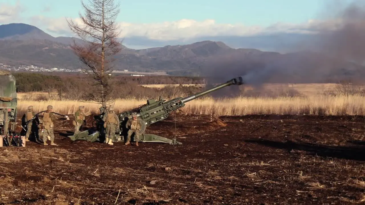 3Rd Marine Division Soldiers Fire Howitzers During An Artillery Relocation Training Exercise At Camp Fuji Japan