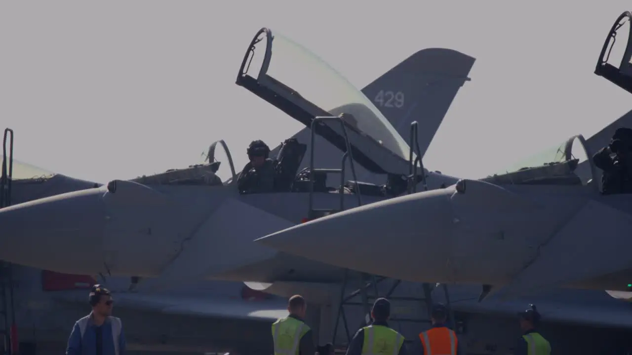 Raf Eurofighter Typhoon Jet Aircraft stationed at RAF Coningsby Lincolnshire preparing for runway taxi and take off service engineers seen as well as the aircraft pilot