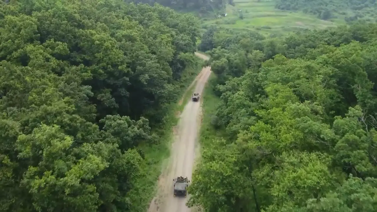 Aerial Drone Footage Of Humvees 25Th Transportation Battalion Soldiers Practice Shooting Targets Convoy Live Machine Gun Fire Training Exercise Korea