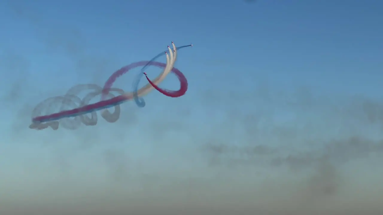 Formation and Double Spin Maneuver Performed by the Red Arrows Aerobatic Team in Kuwait