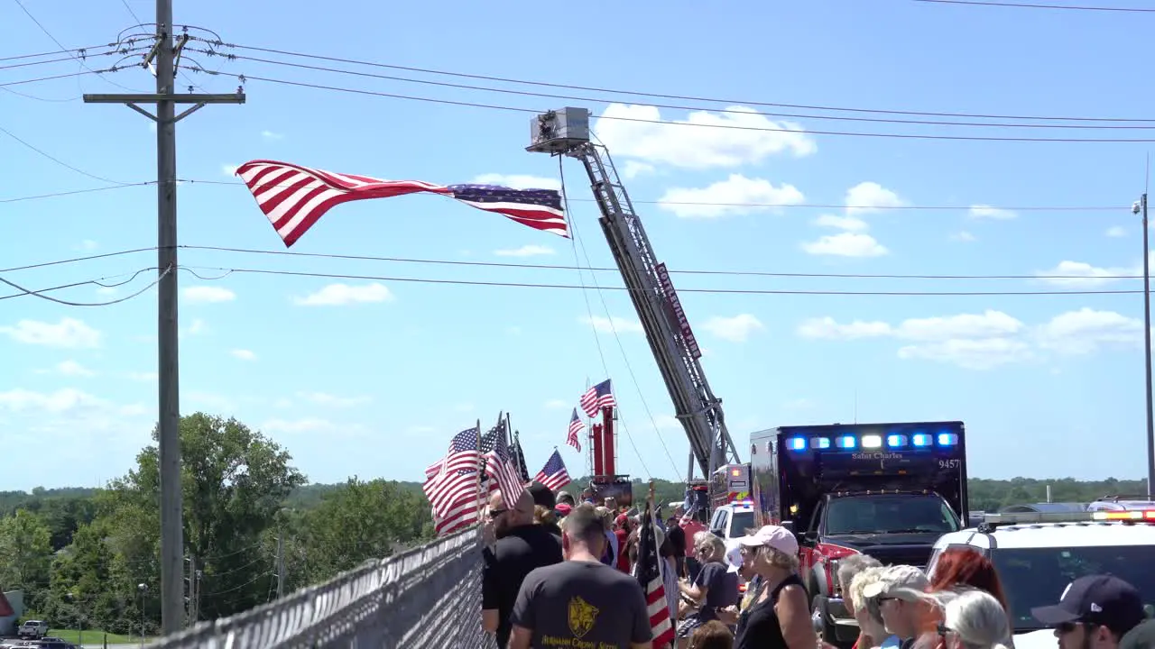 Crowd gathered on overpass to welcome fallen soldier home