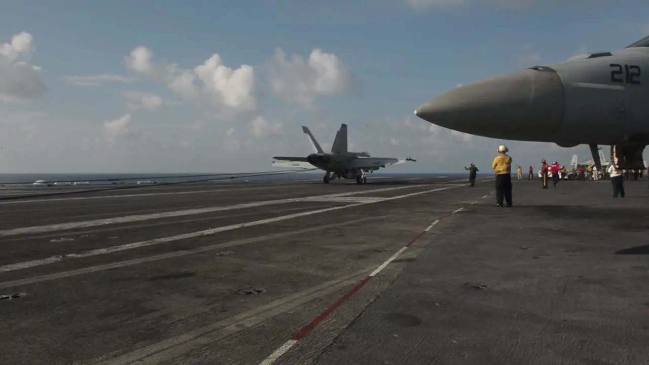 Flight Operations And Fighter Jet Landing On The Deck Of The Uss Theodore Roosevelt In The South China Sea